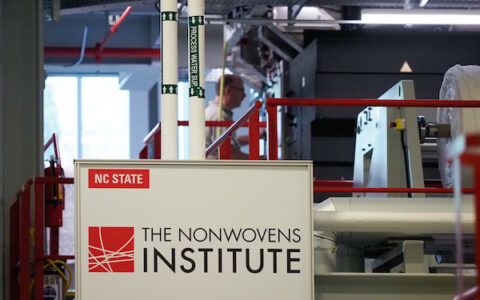 The Nonwovens Institute (NWI) at North Carolina State University is proactively responding to the COVID-19 pandemic. Our aim is to fully leverage and fortify our facilities to produce facemasks that are desperately needed in the coronavirus fight. Thus, with the full support of NC State, NWI is dedicating its meltblown and spunbond nonwoven making facilities and expertise to produce specially designed fabrics that can be delivered to USA manufacturers to assemble facemasks. Photo by Marc Hall